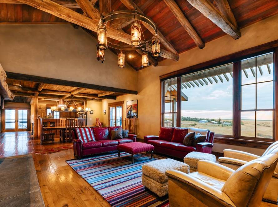 Well-appointed living room with cozy furniture arranged around a fireplace