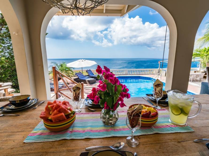 Oceanfront luxury vacation rental house with a pool overlooking a small island