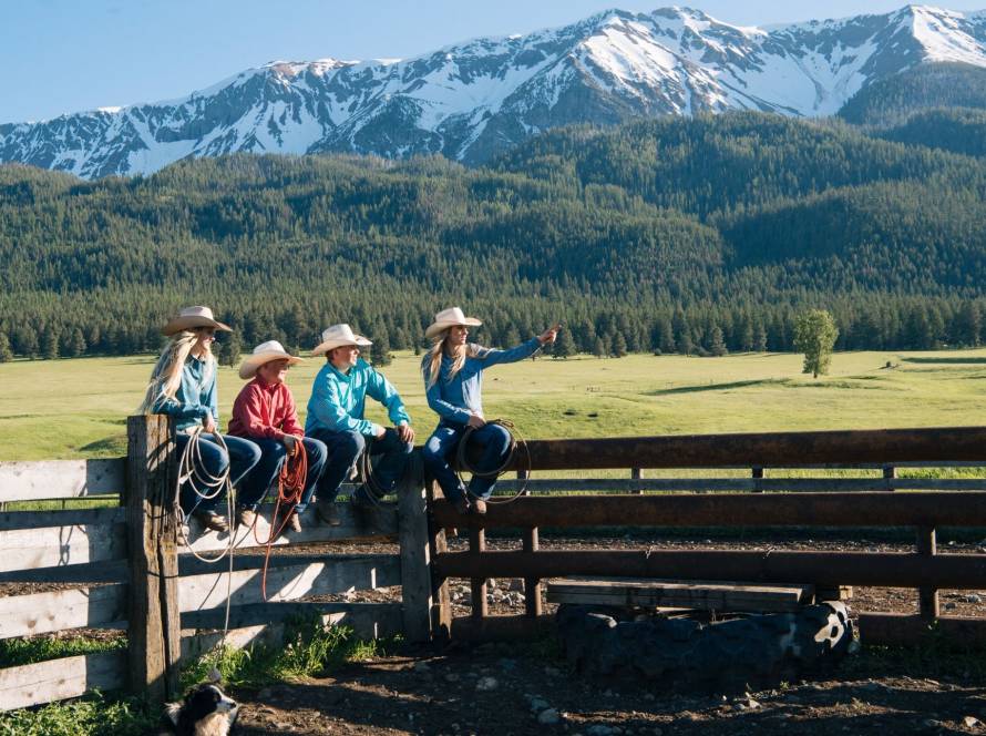 Family in cowboy attire enjoying scenic ranch views during a vacation in the Dominican Republic